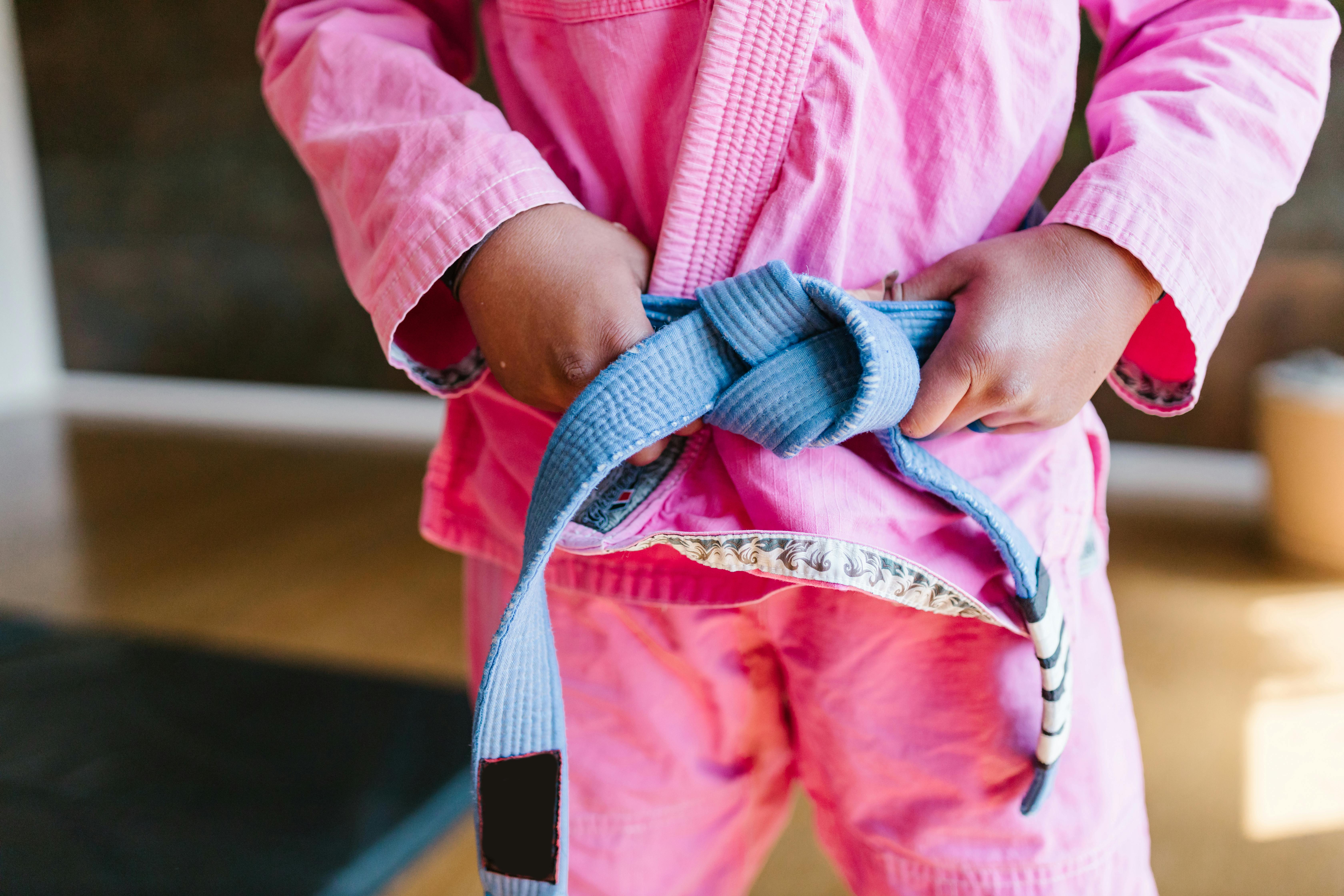 girl wearing pink karate clothes
