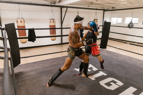 Free A Man and a Woman Doing Boxing Training Stock Photo
