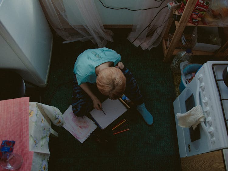 Child Sitting On Kitchen Floor Painting