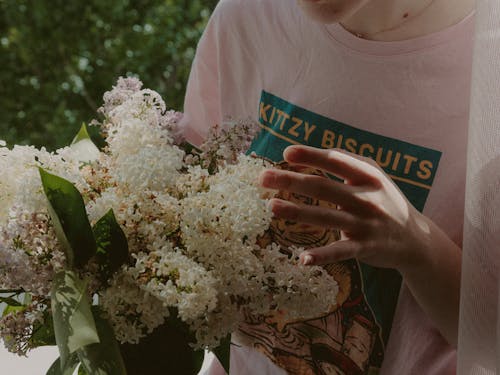 A Person Holding White Flower Bouquet