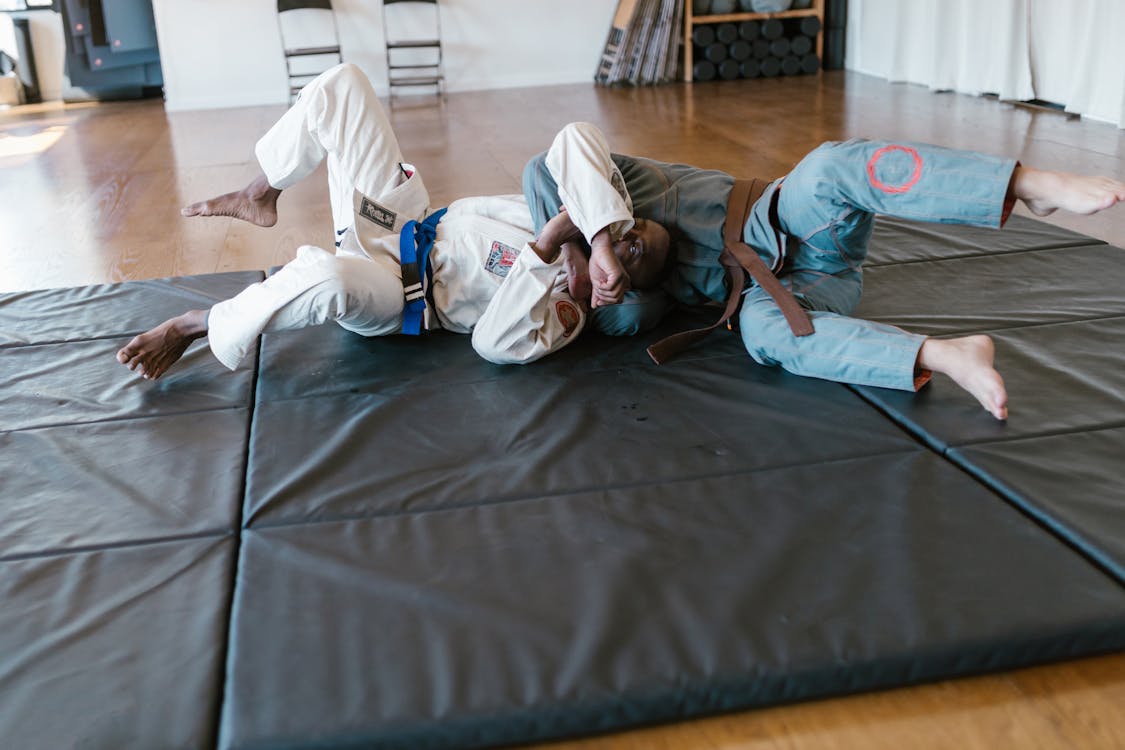 Holding an opponent down is a common move in Brazilian Jiu-jitsu. Photo from Pexels.