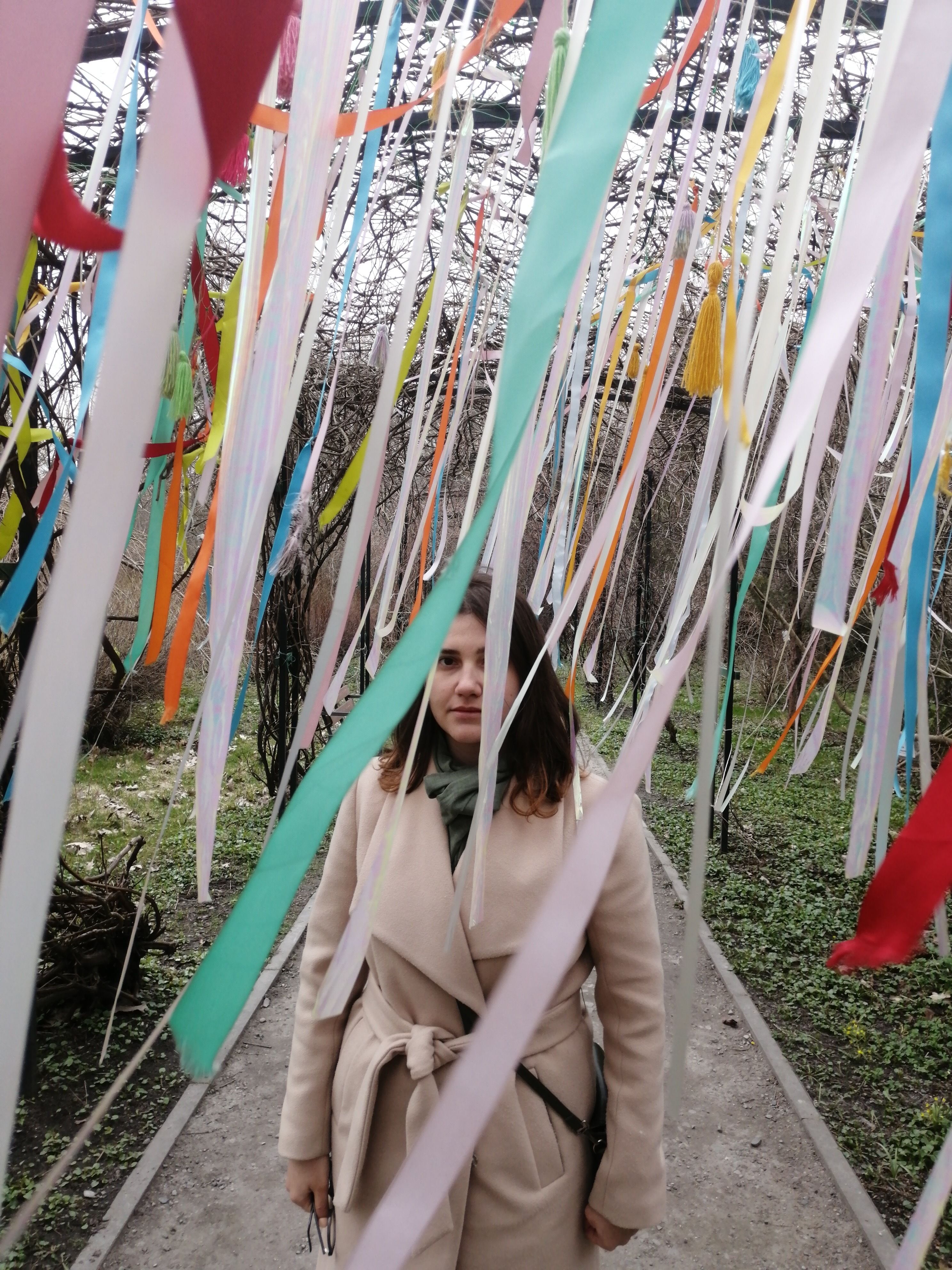 Woman Standing under Colorful Ribbons in Park · Free Stock Photo