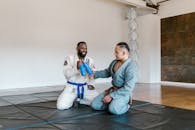 2 Men Sitting on Blue Floor