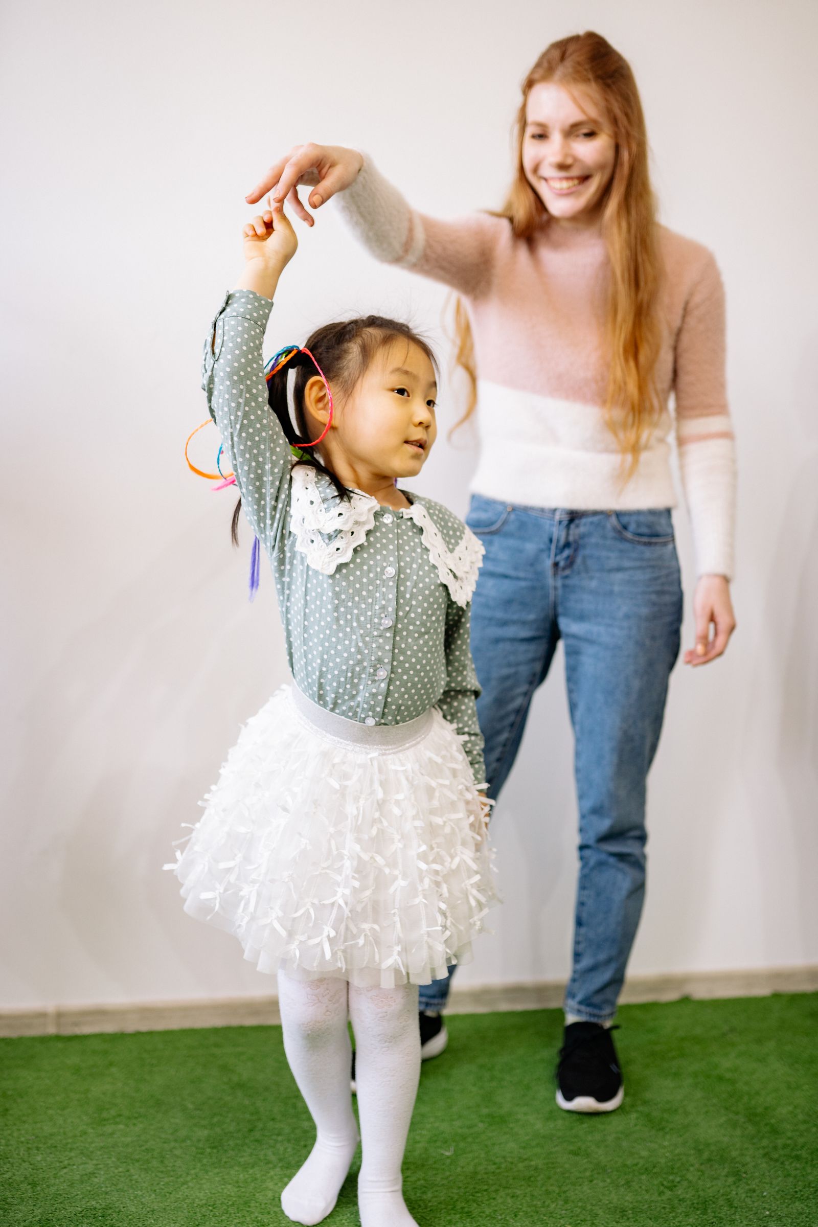 Nanny helping children with learning activity