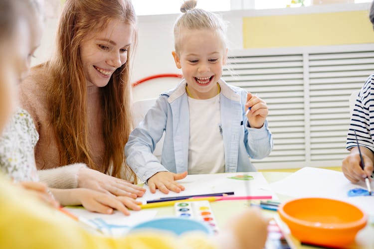 Happy Little Girl Learning To Paint