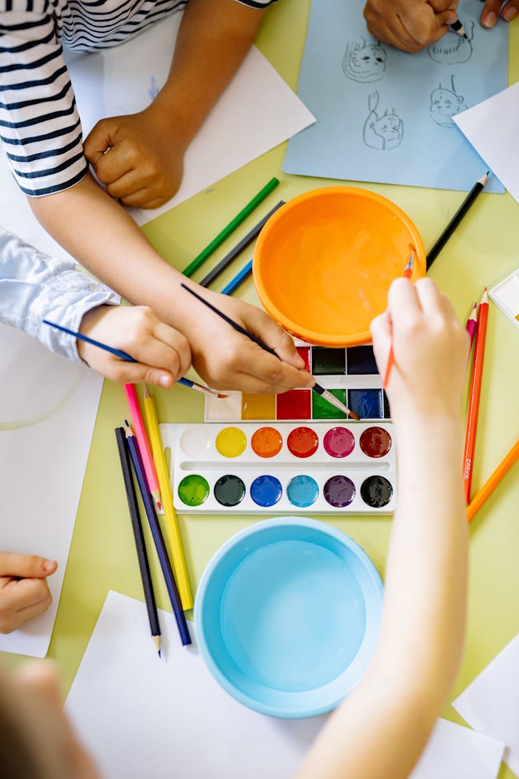 Children Painting With Water Color 