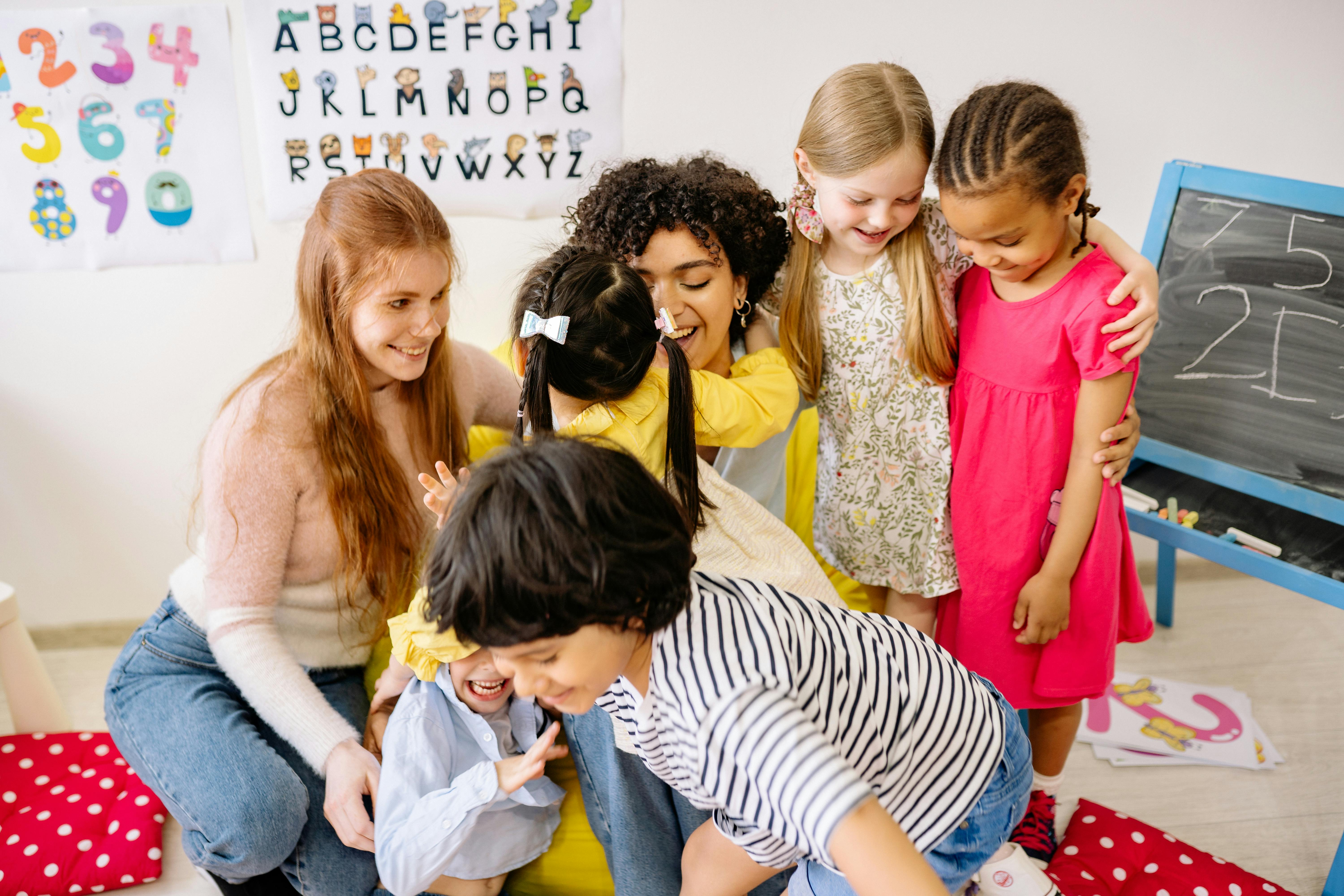 children showing love for their teacher