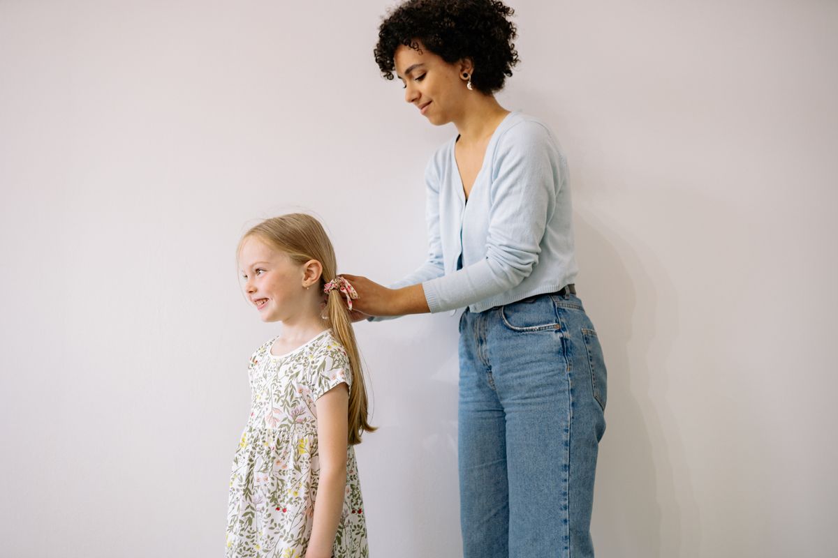 Teacher guiding children in a learning activity