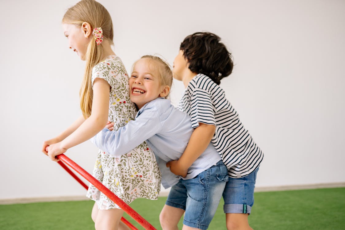 Free Two Girls And A Boy Having Fun Stock Photo