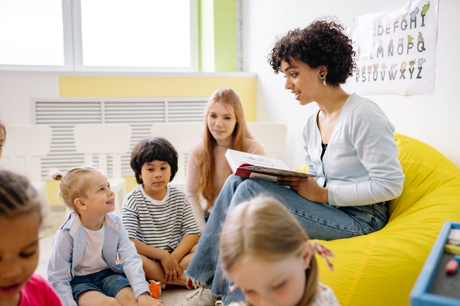 ChildCheck dashboard shown on a tablet in a bright Ohio classroom