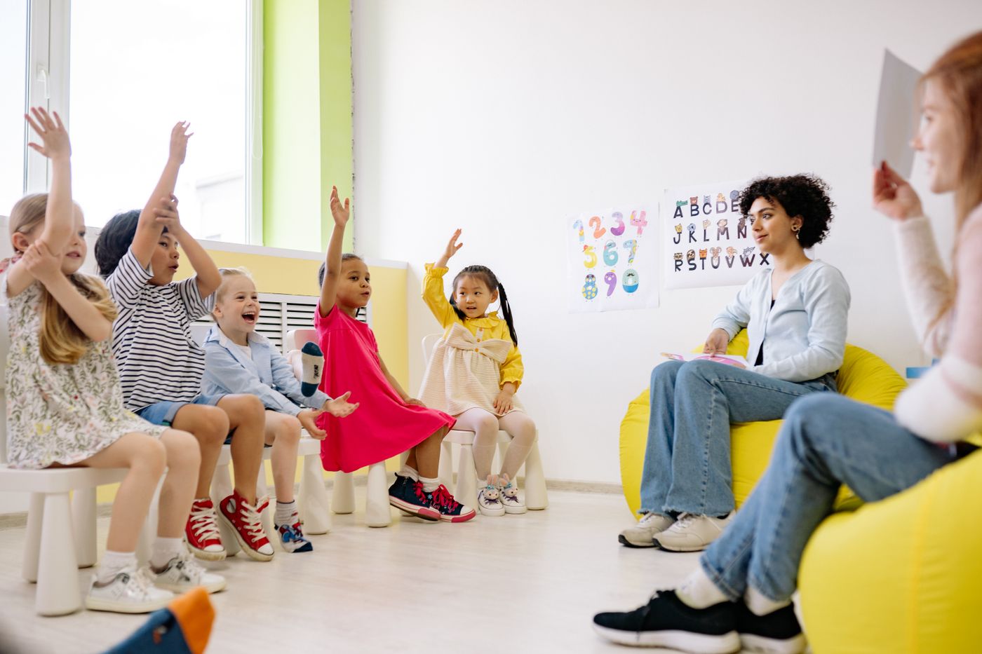 Young children participating in a classroom lesson