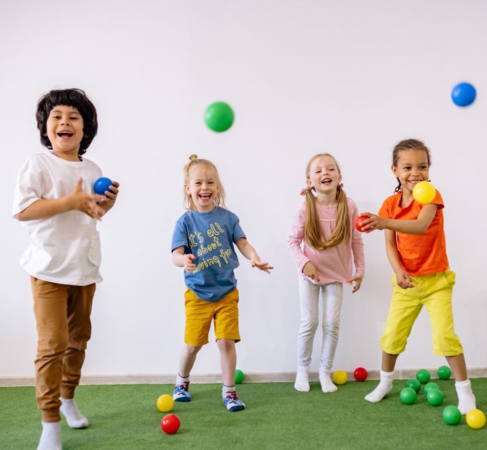 Children playing with colourful balls