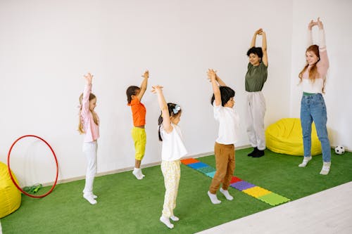 Children With Teachers Doing Stretching exercise