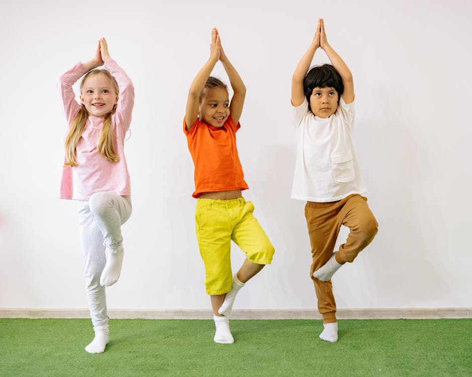 Free Active Children Doing Balancing Exercises Stock Photo