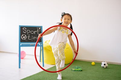 Children reading books outdoors