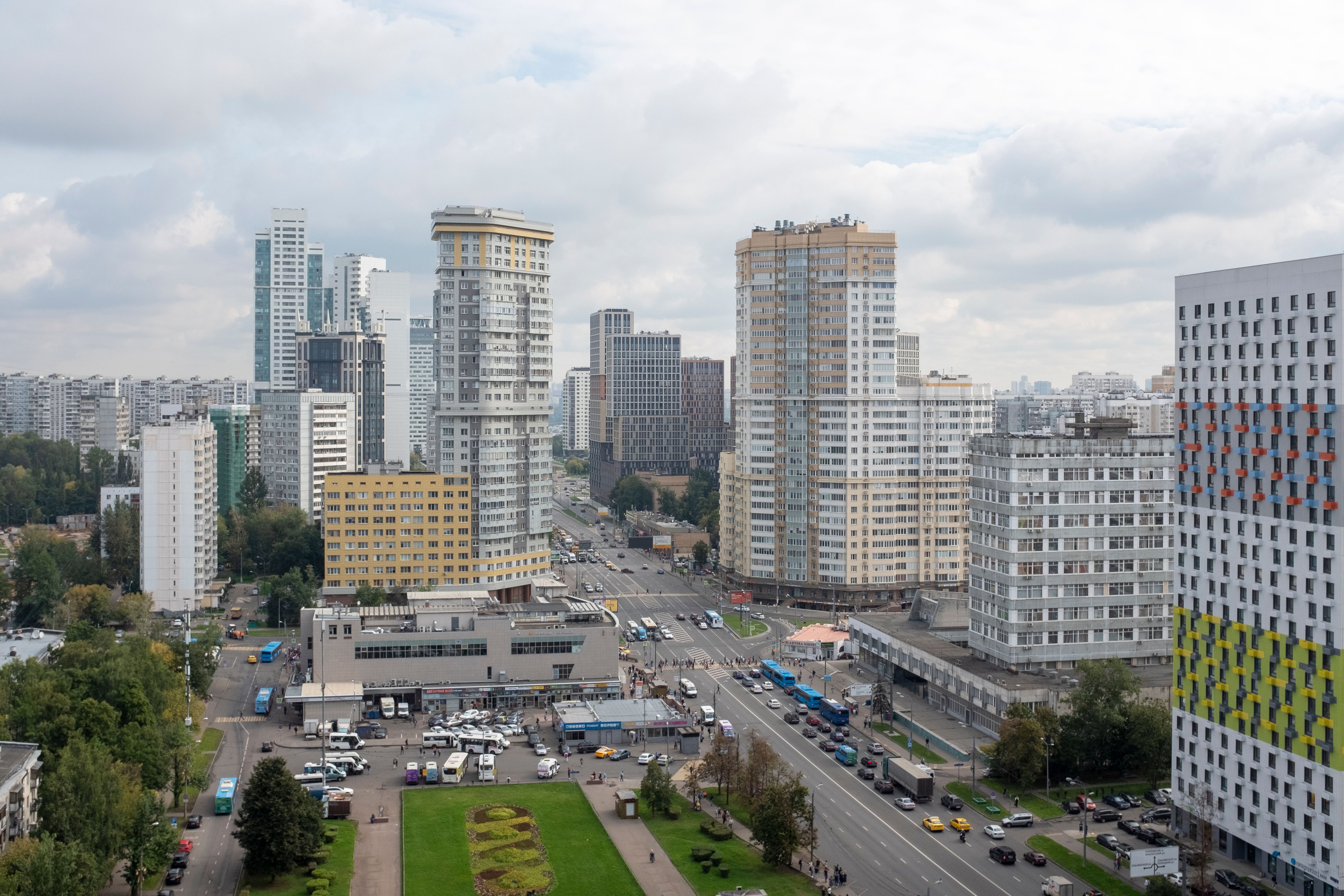 Aerial view of Moscow showcasing modern architecture, roads, and urban life.