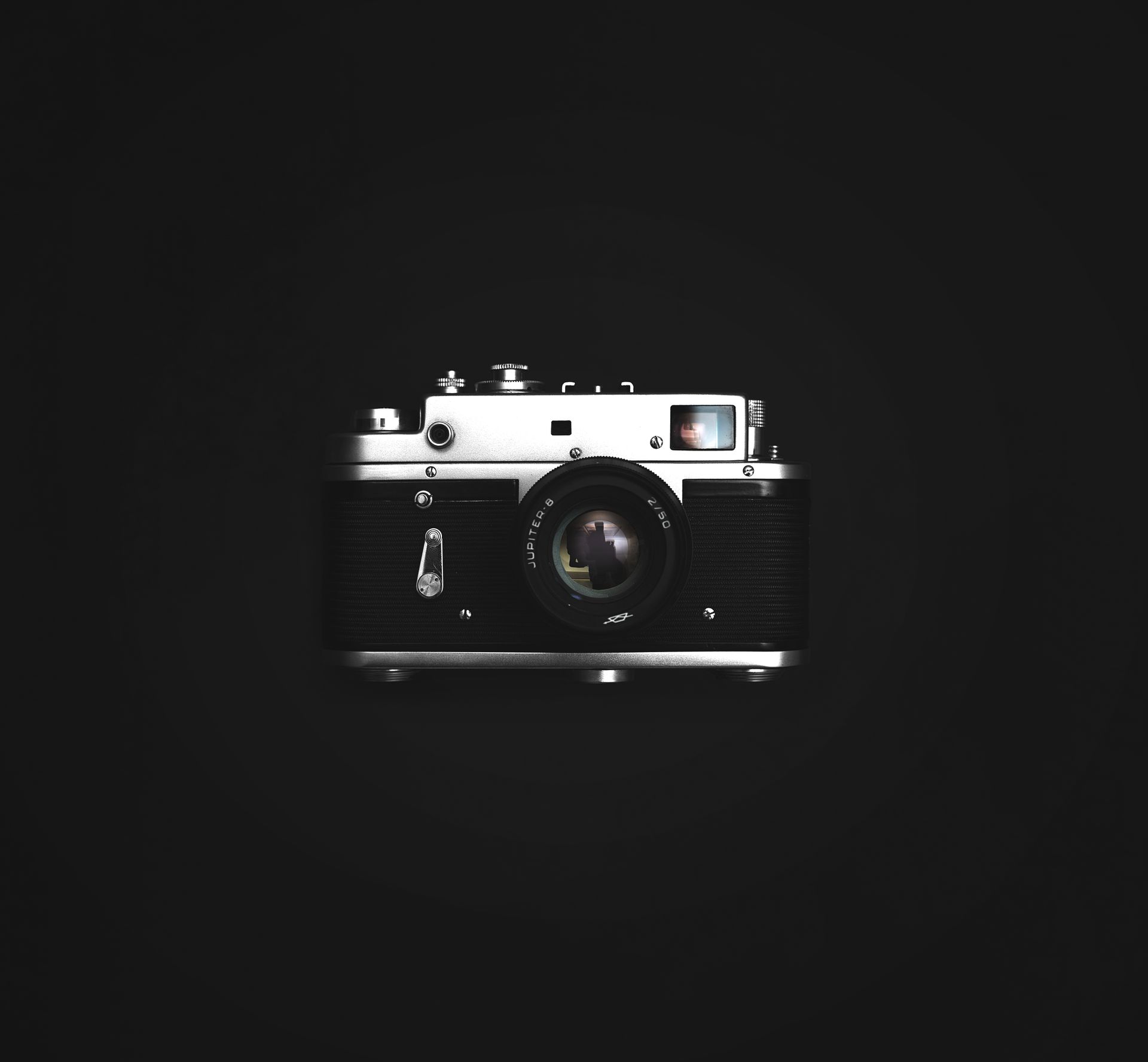 Close Up Photograph of Classic Black and Silver Camera