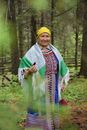 Woman in Traditional Clothing in the Woods