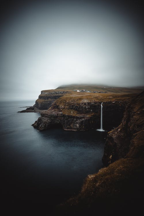 Scenic View of a Cliff and a Waterfall