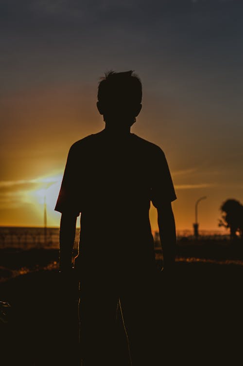 Free Silhouette of a Person During Sunset Stock Photo