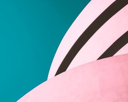 Modern abstract architectural image with pink curves and blue sky. Ideal for creative design backdrops.