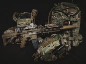 Black and Brown Rifle on Brown and Green Camouflage Textile
