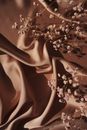 White Flowers on Brown Textile
