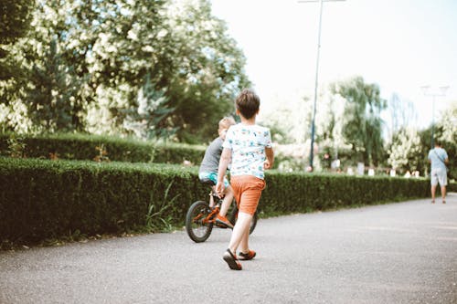Free A Young Boy Riding a Bicycle Stock Photo