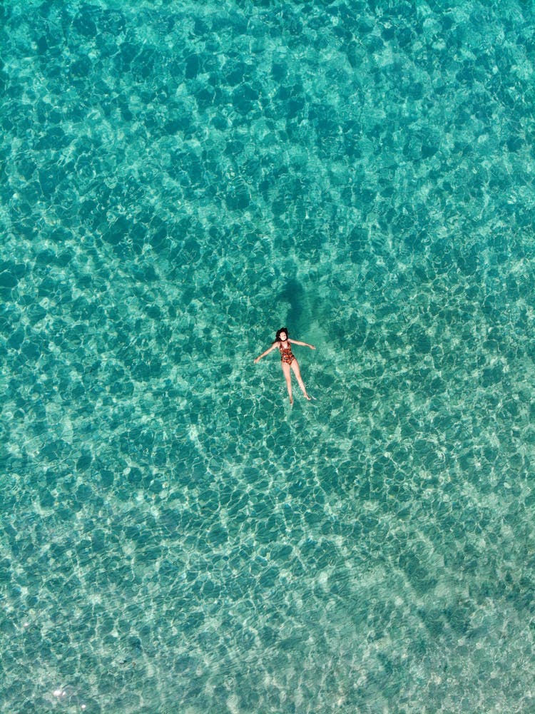 A Woman Floating On The Sea