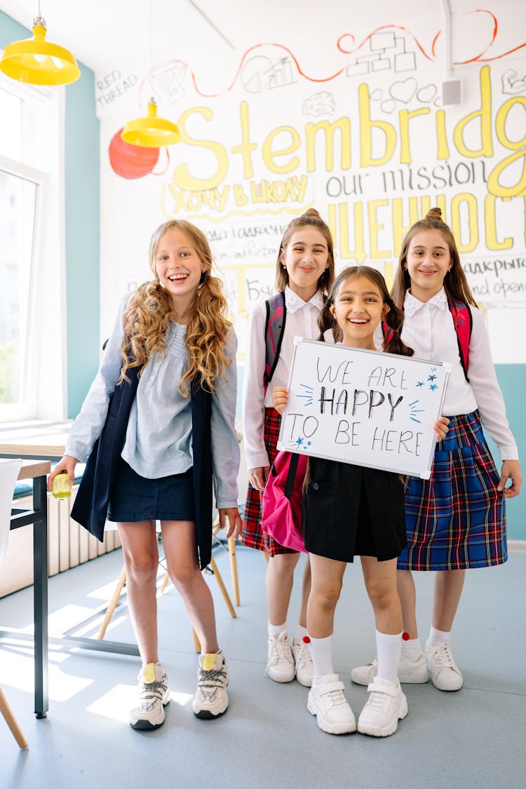 School Girls Smiling While Standing 