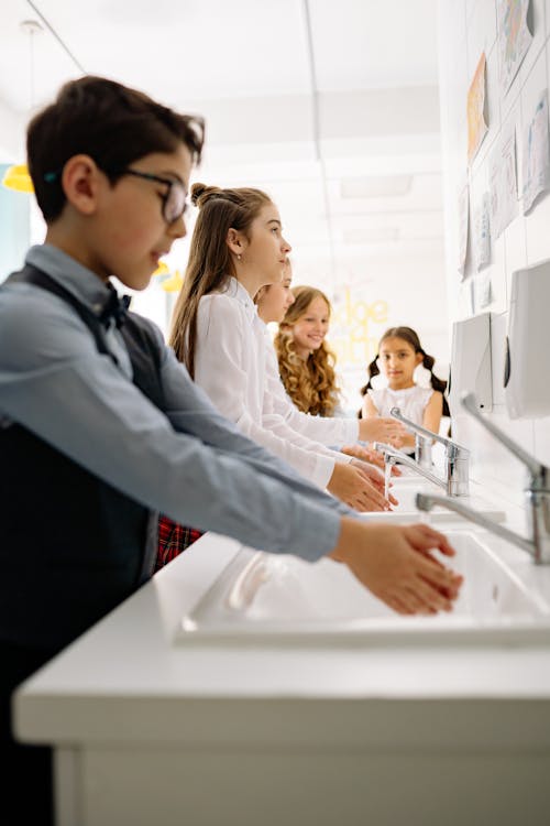 Free Children Washing Their Hands Stock Photo