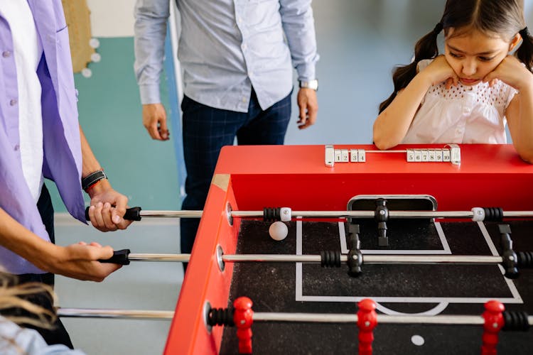 A Person Playing Foosball