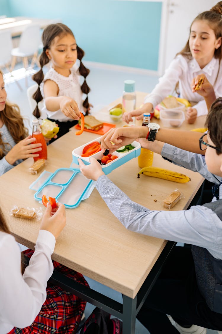 Children Eating On A Table