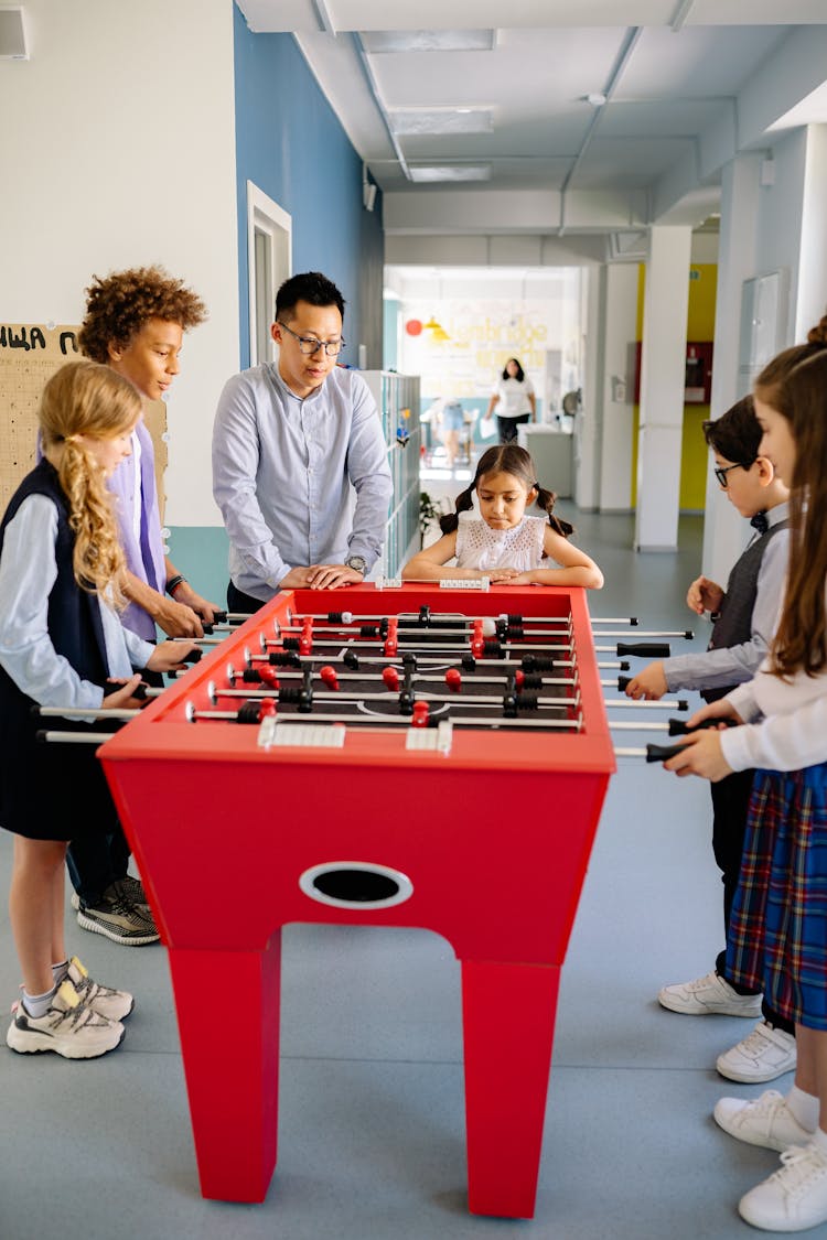 Children Playing Foosball