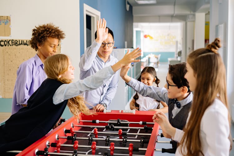 Children Playing Foosball