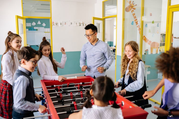 Teacher Plying With His Students