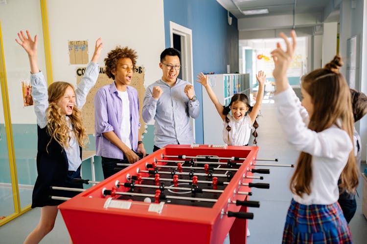 Teacher Playing Table Games With Students