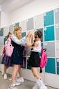 Girls Having Fun Playing Near the Lockers at School