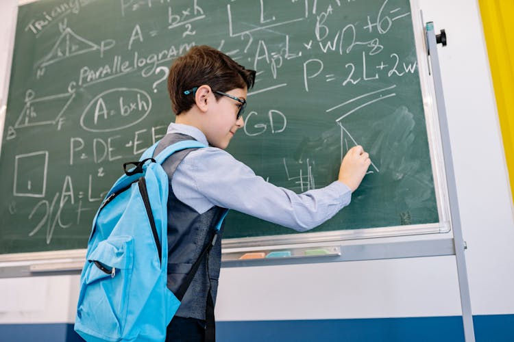 Smart Boy Solving A Math Problem 