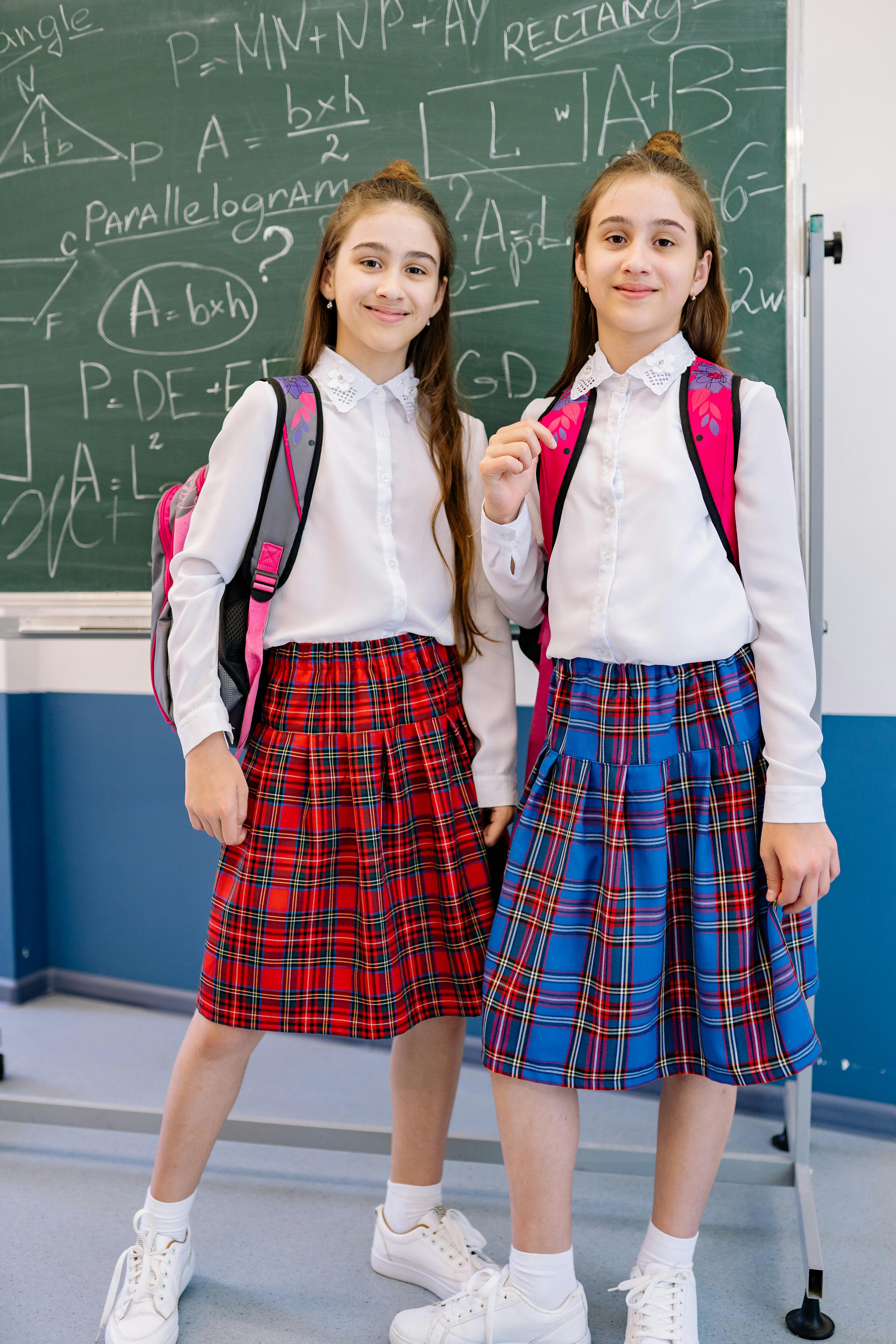 girls in white long sleeve shirt uniform wearing white sneakers