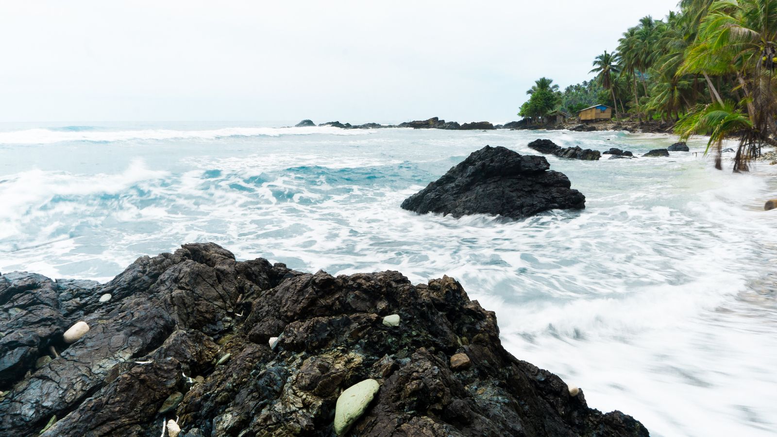 Gray rock formations on sea, Sao Tome and Principe