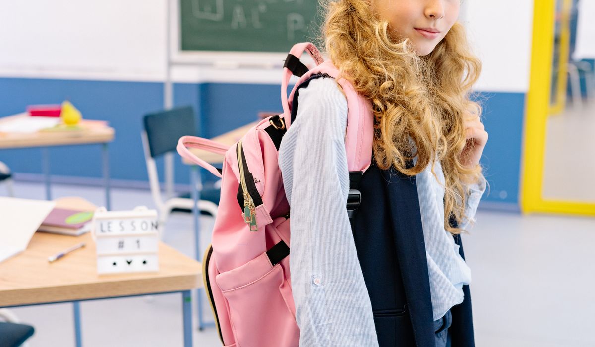 Student wearing a school backpack
