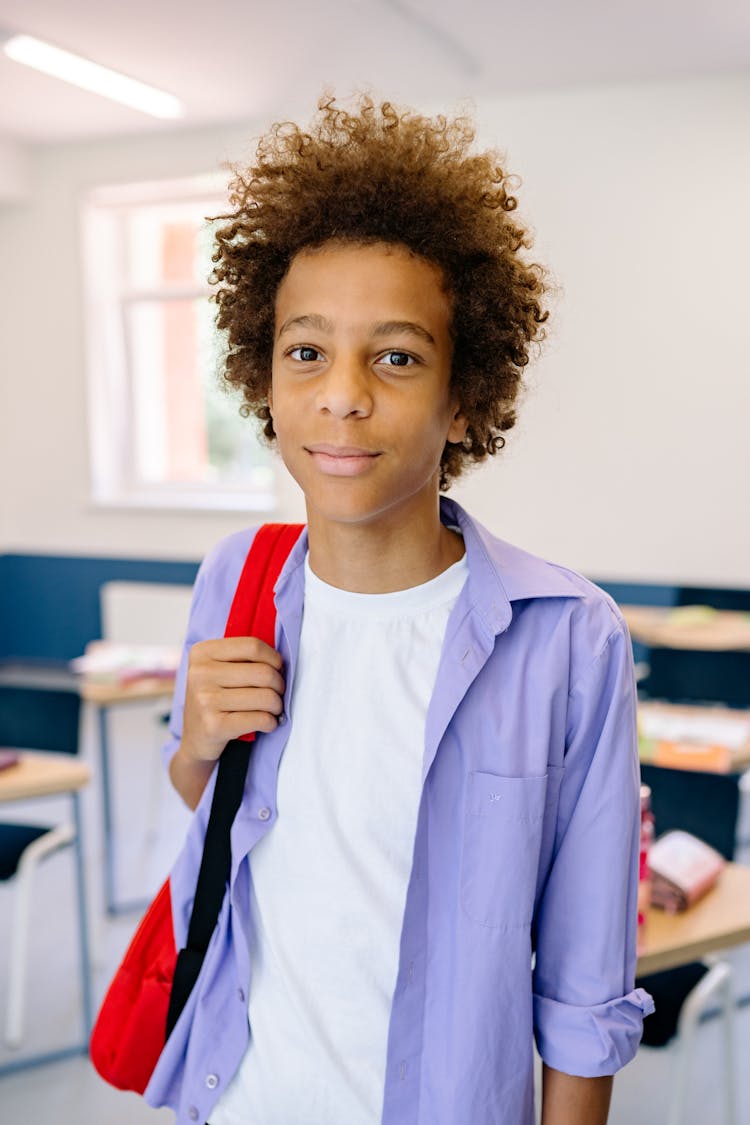 A Male Student Carrying His Backpack