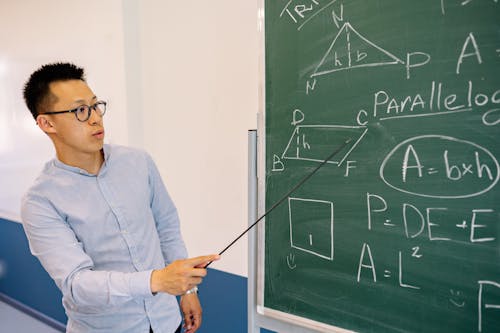Free Teacher Teaching a Lesson Stock Photo