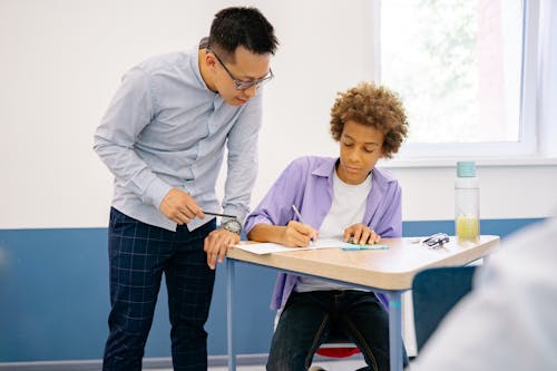 Teacher Teaching His Student