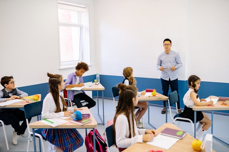 Teacher Teaching Inside The Classroom