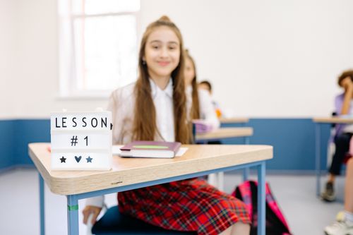Free A classroom setting with a focus on learning and students engaging in lesson number one. Stock Photo