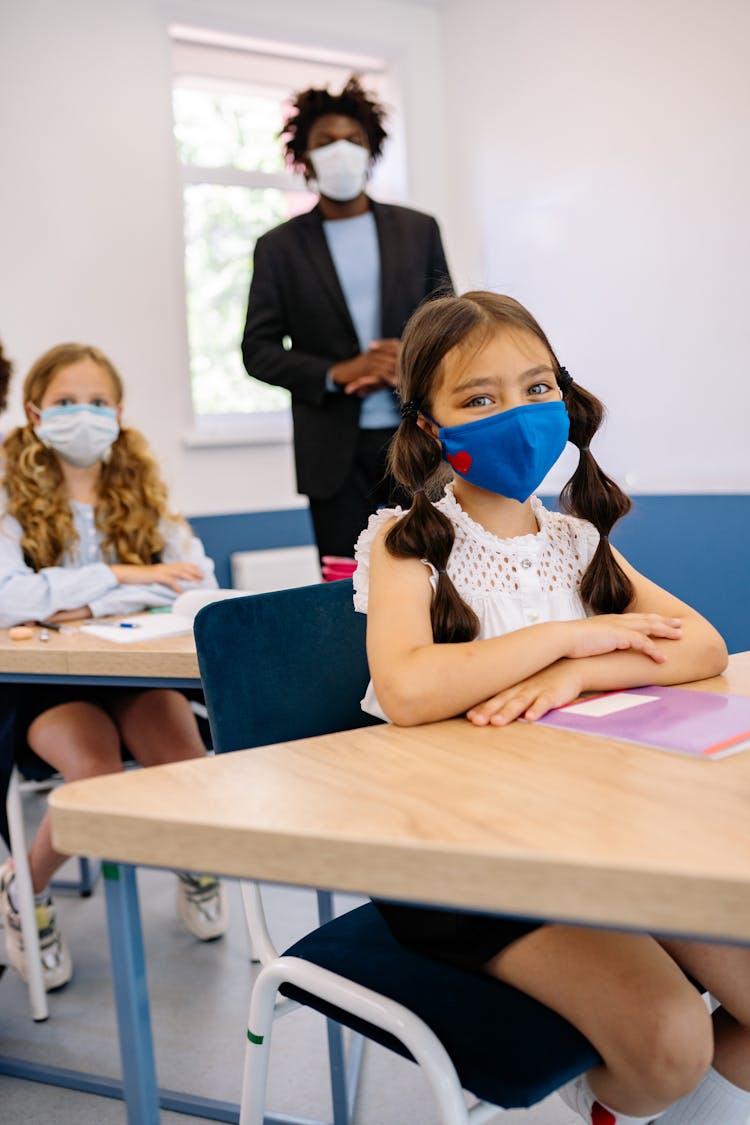 Girl Wearing Blue Face Mask Inside The Classroom