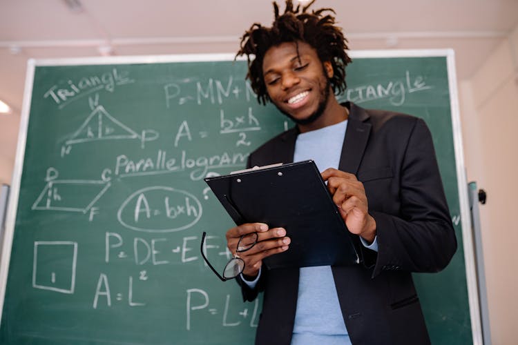 Teacher Holding A Clipboard