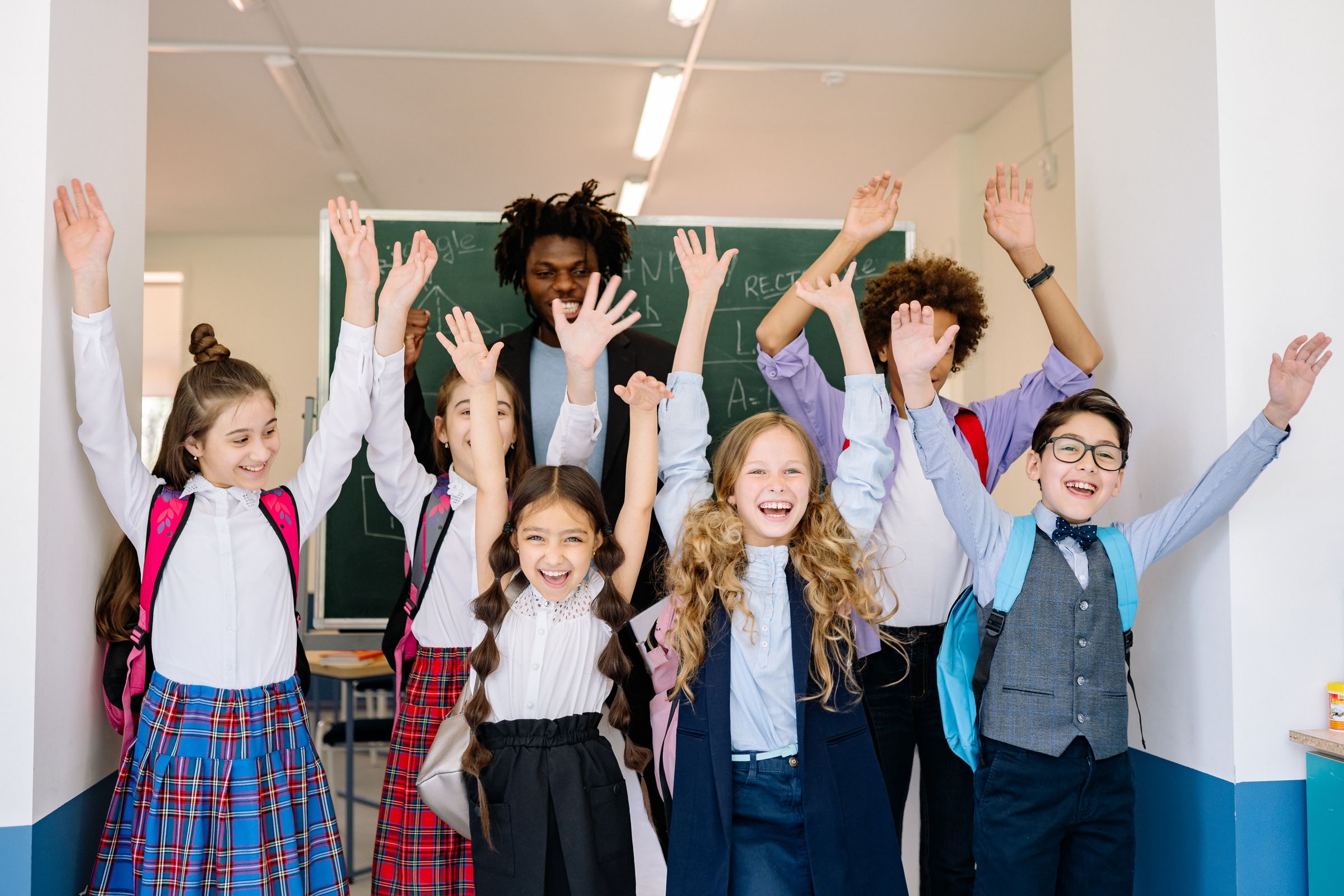 A joyful, diverse group of children learning together in an inclusive classroom